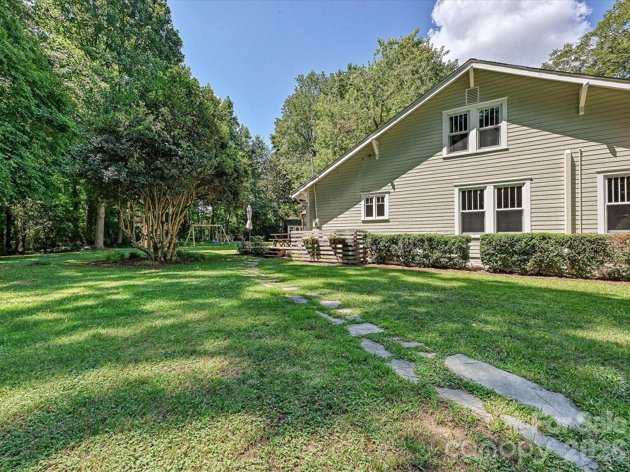 Nestled beneath mature shade trees on a picturesque homesite, this timeless home offers exceptional curb appeal and a peaceful country setting. - 3514 Kelly Road, Charlotte
