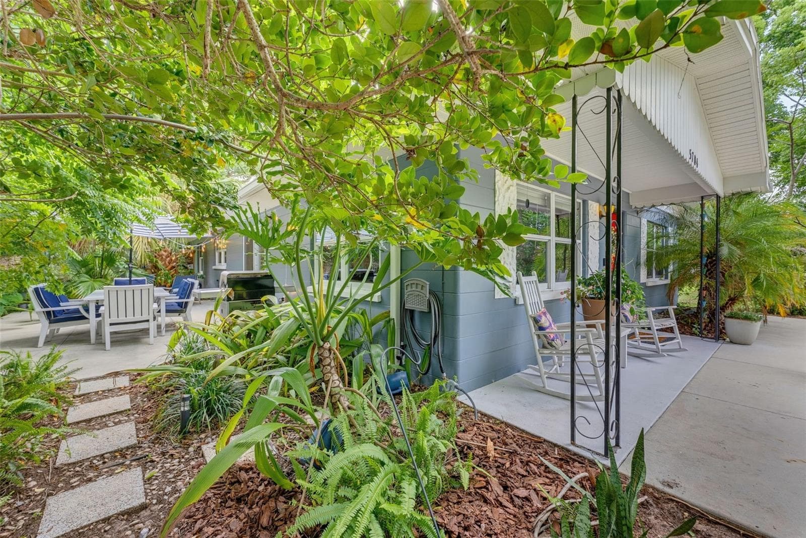 Walkway from front porch to side patio. - 5704 13TH ST, ZEPHYRHILLS
