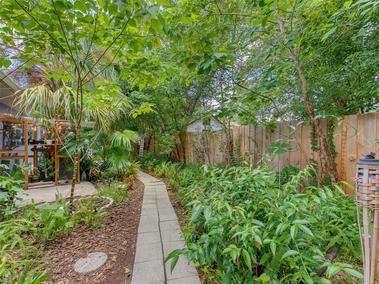 Walkway from backyard to side patio. - 5704 13TH ST, ZEPHYRHILLS