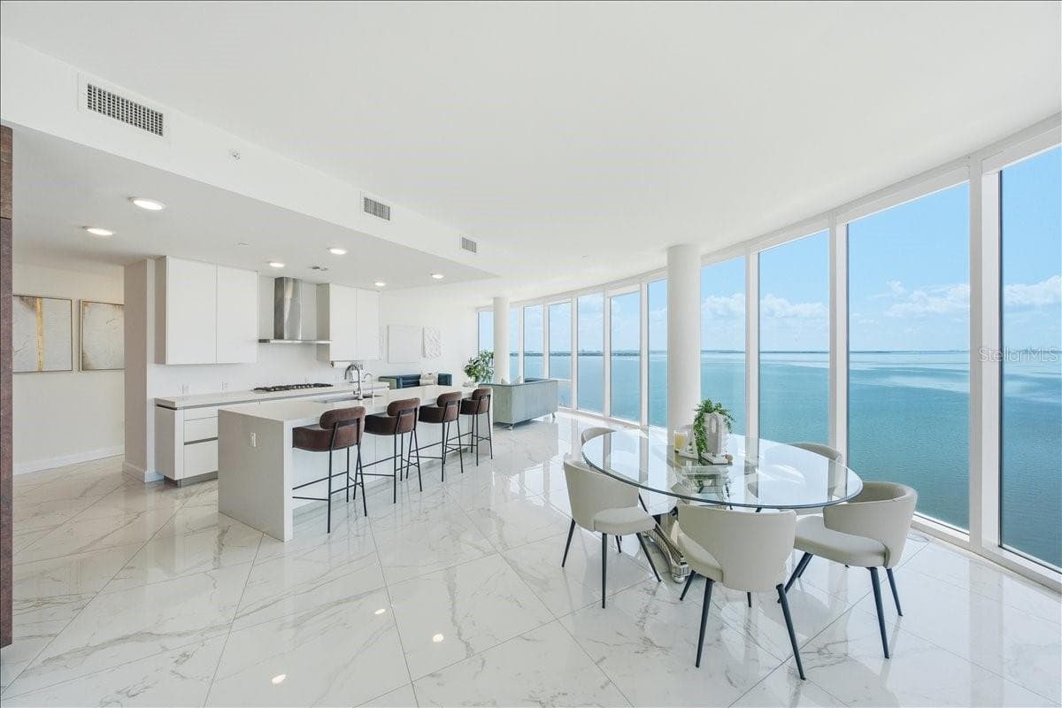 Elegant dining space with spectacular water views. - 2900 W BAY TO BAY BLVD #1401, TAMPA
