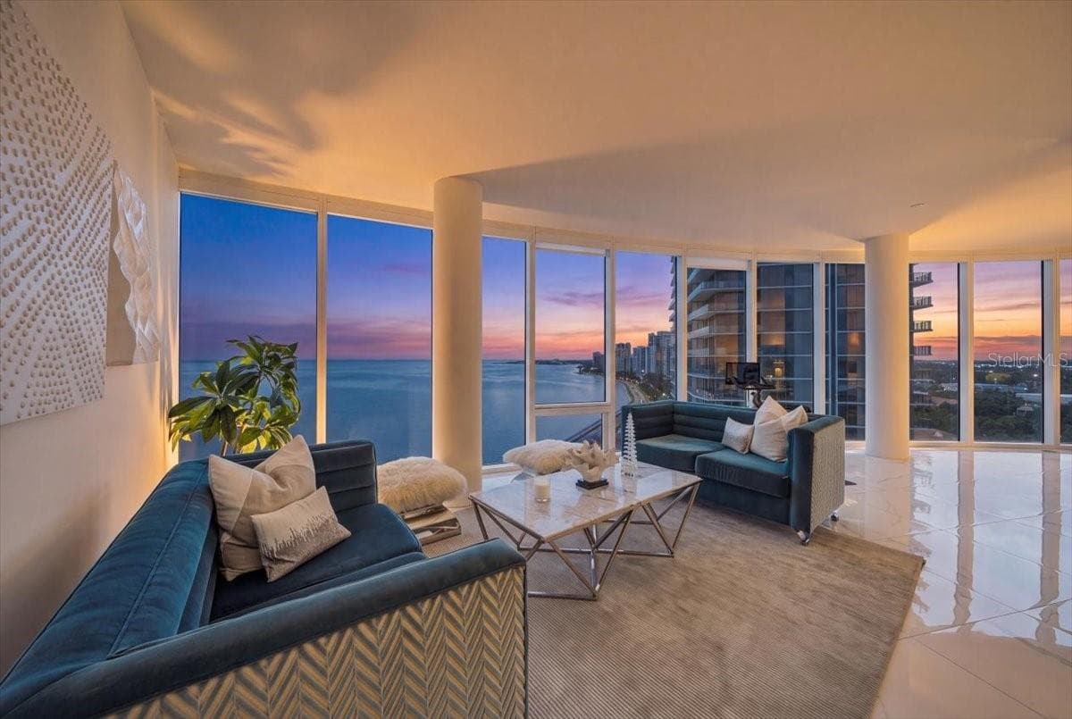 Spacious living area with panoramic waterfront views. - 2900 W BAY TO BAY BLVD #1401, TAMPA