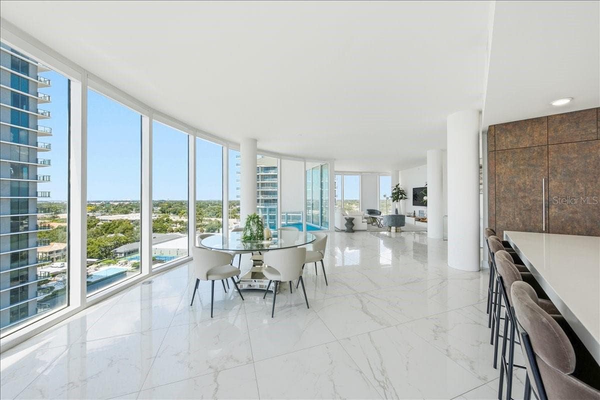 Floor-to-ceiling impact glass filling the home with natural light. - 2900 W BAY TO BAY BLVD #1401, TAMPA