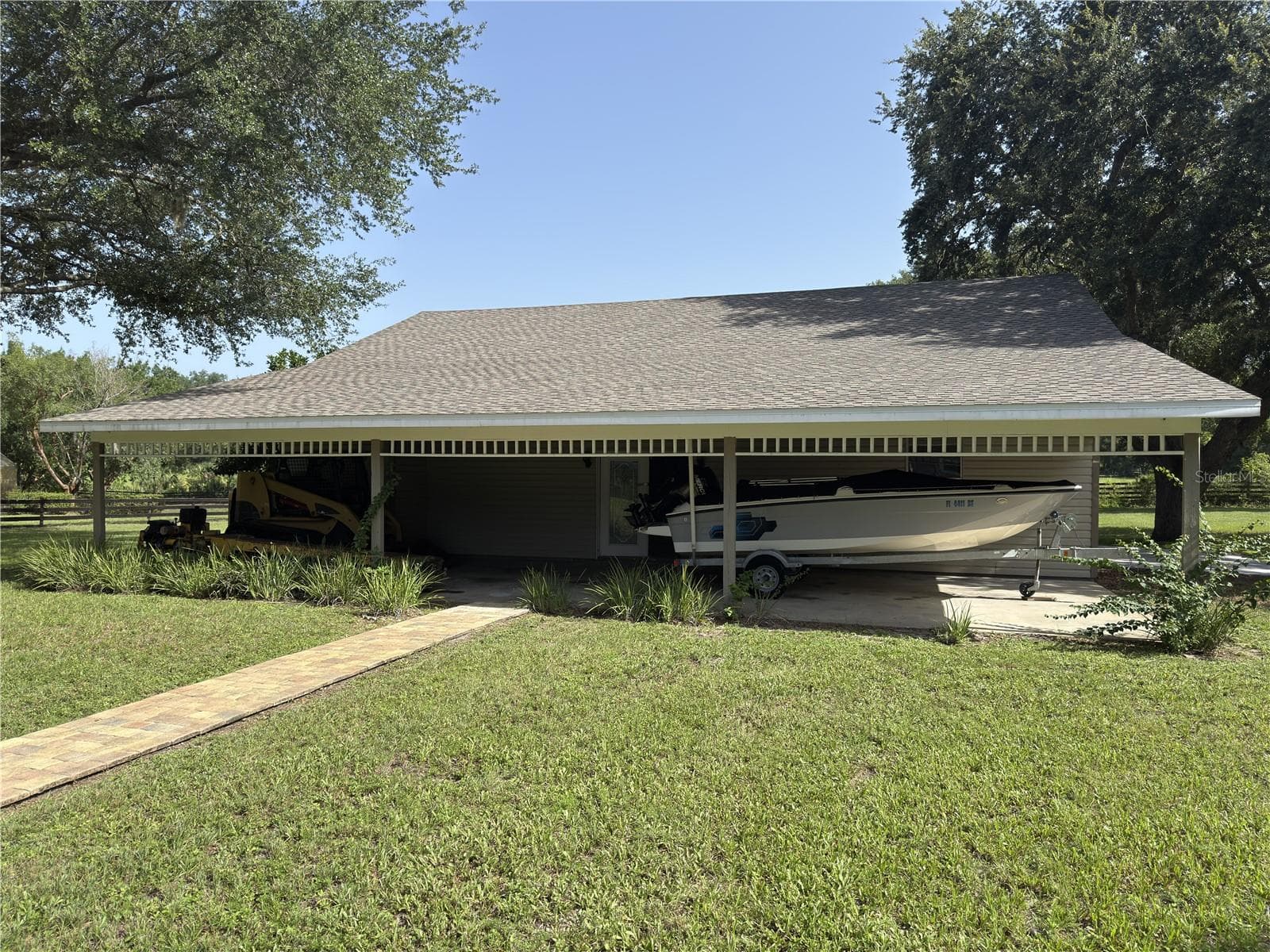 This covered area for the garage could easily be converted to horse stalls. - 32137 WOLF BRANCH LN, SORRENTO