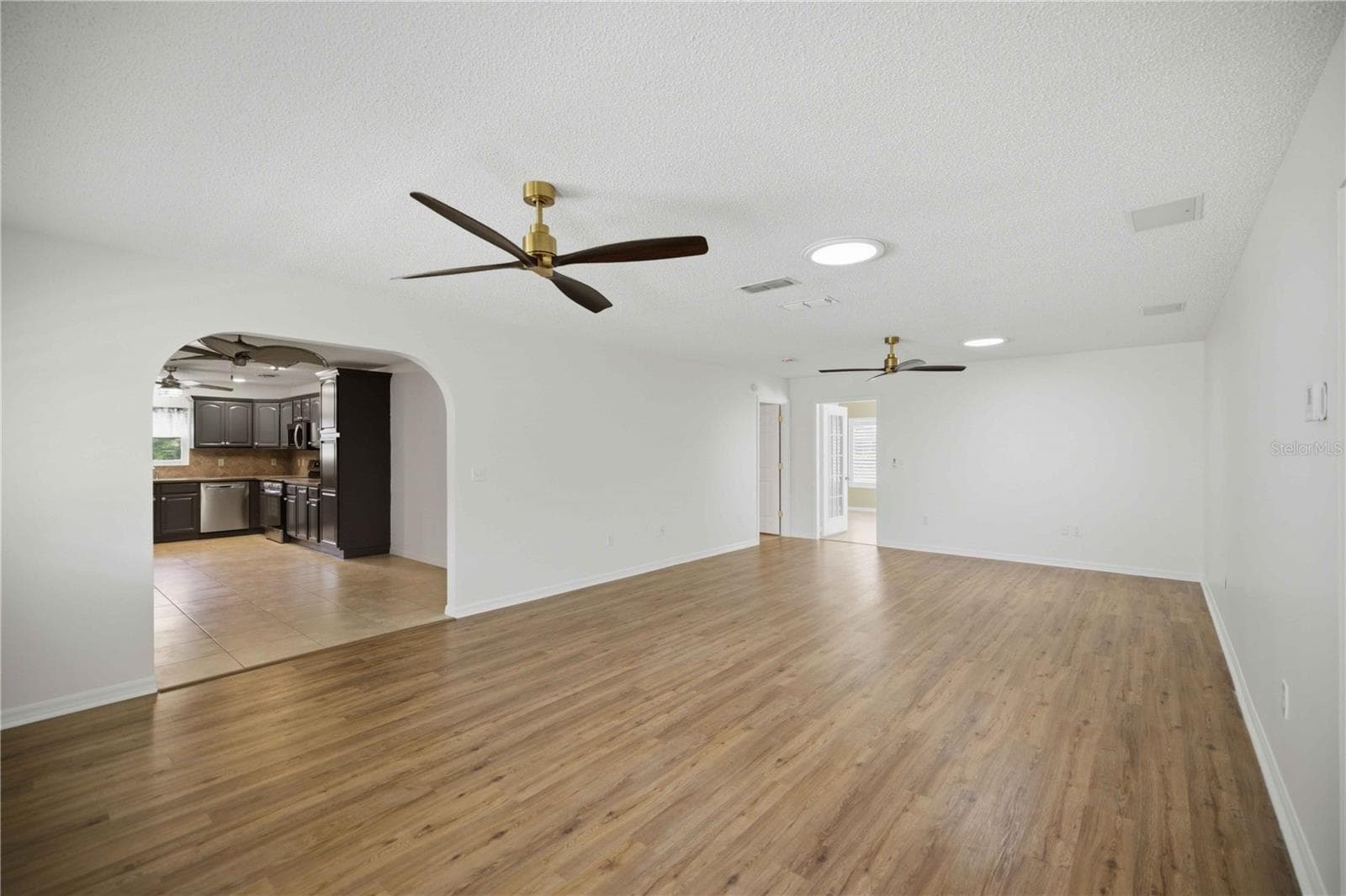 Living Room 3 Into DR/Kitchen - 17676 SE 102ND CIR, SUMMERFIELD