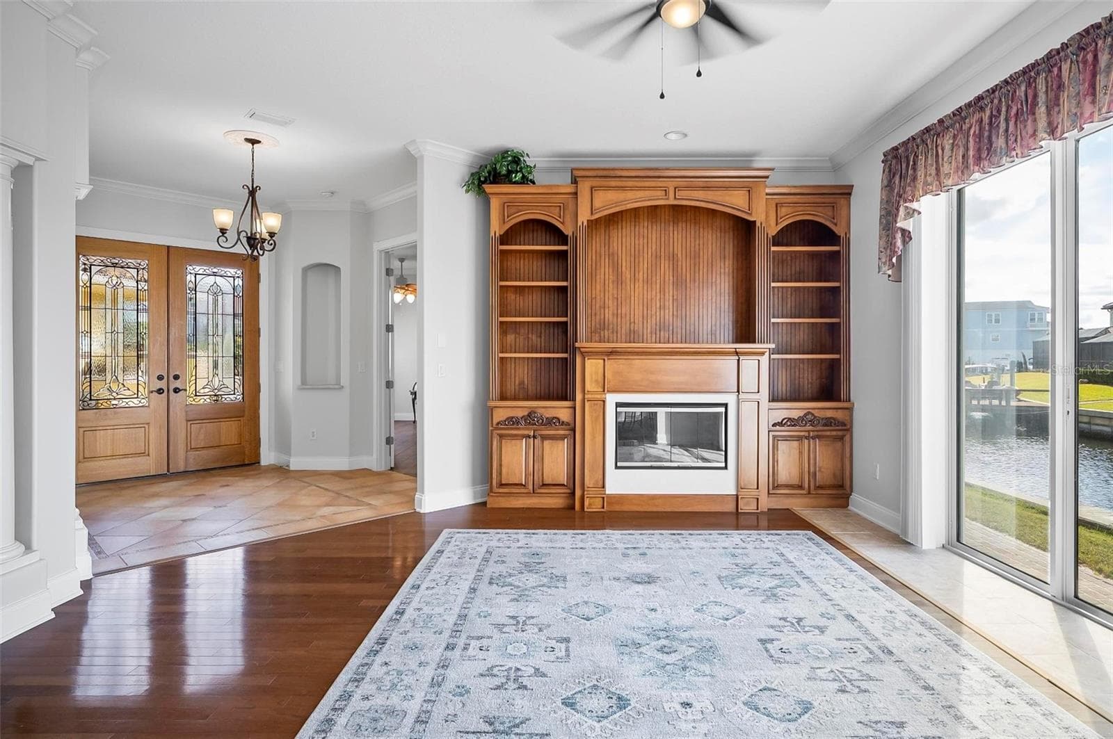Custom solid wood built-in is part of formal living room - 88 HIDDEN CV, FLAGLER BEACH