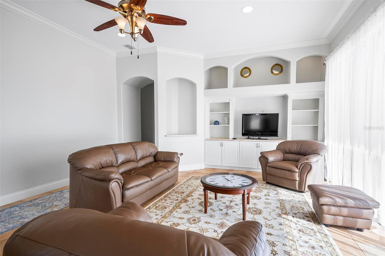 Spacious family room with built in entertainment center and shelving - 88 HIDDEN CV, FLAGLER BEACH