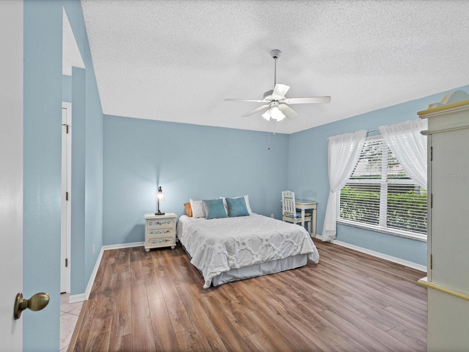 Primary Bedroom with luxury vinyl plank flooring throughout - 830 MCCALLISTER AVE, SUN CITY CENTER