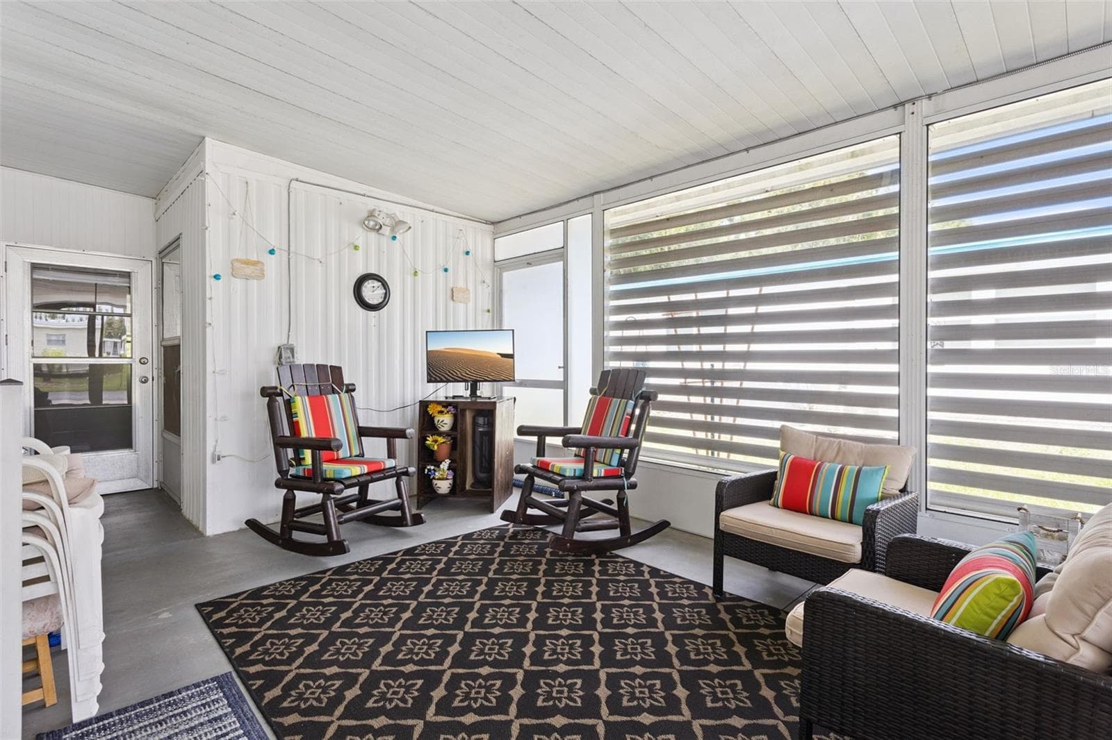 SCREENED LANAI IS BEHIND THE CARPORT AND GIVES PRIVACY TO YOUR OUTDOOR SPACE. - 104 OLEANDER CV, LEESBURG