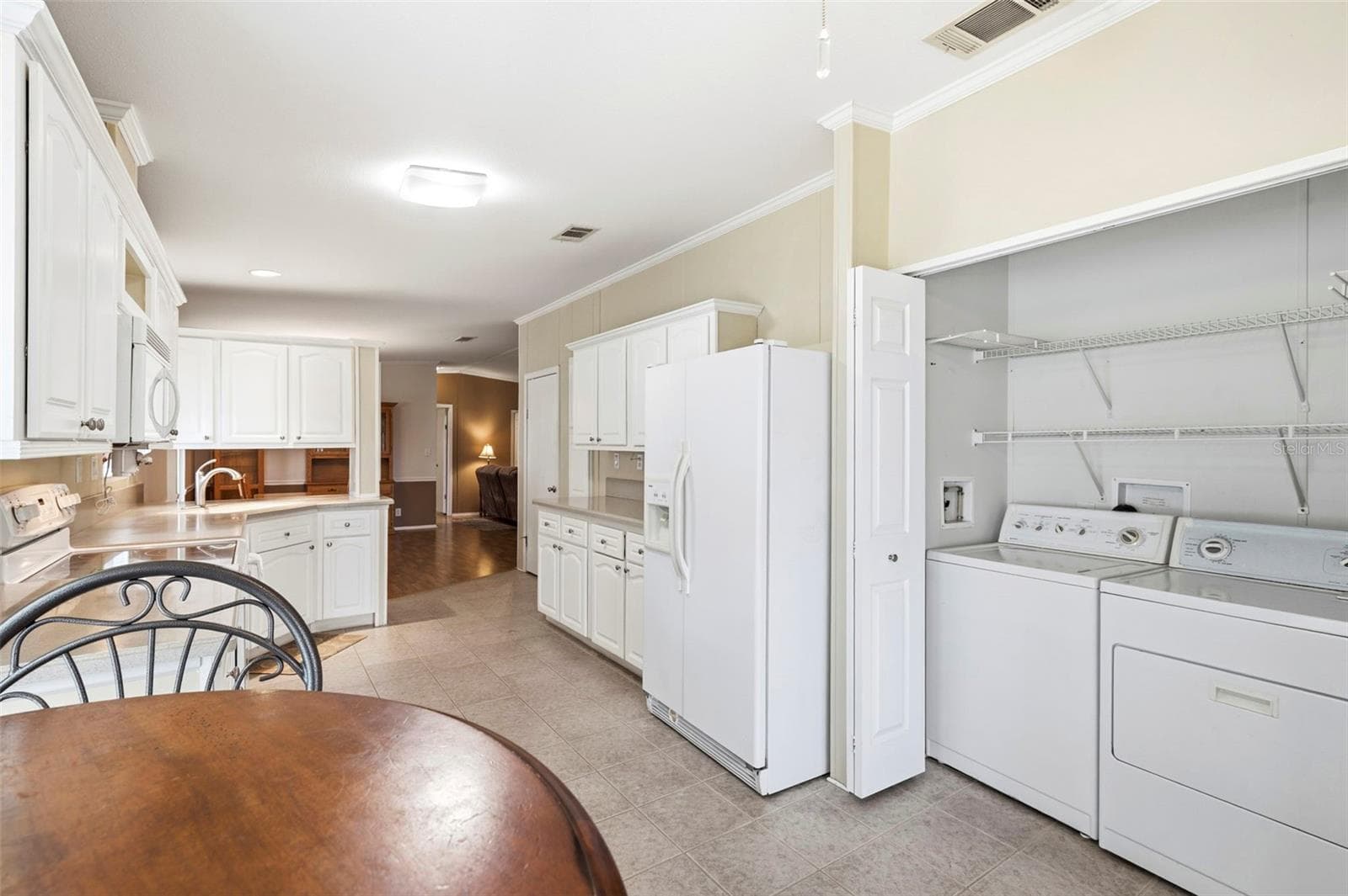 Laundry closet conveniently located off the kitchen - 9790 66TH ST N #357, PINELLAS PARK