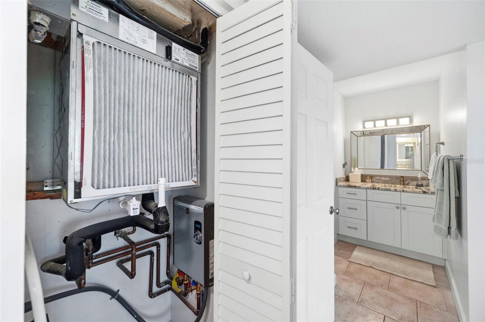 new tankless hot water system - 14800 WALSINGHAM RD #614, LARGO