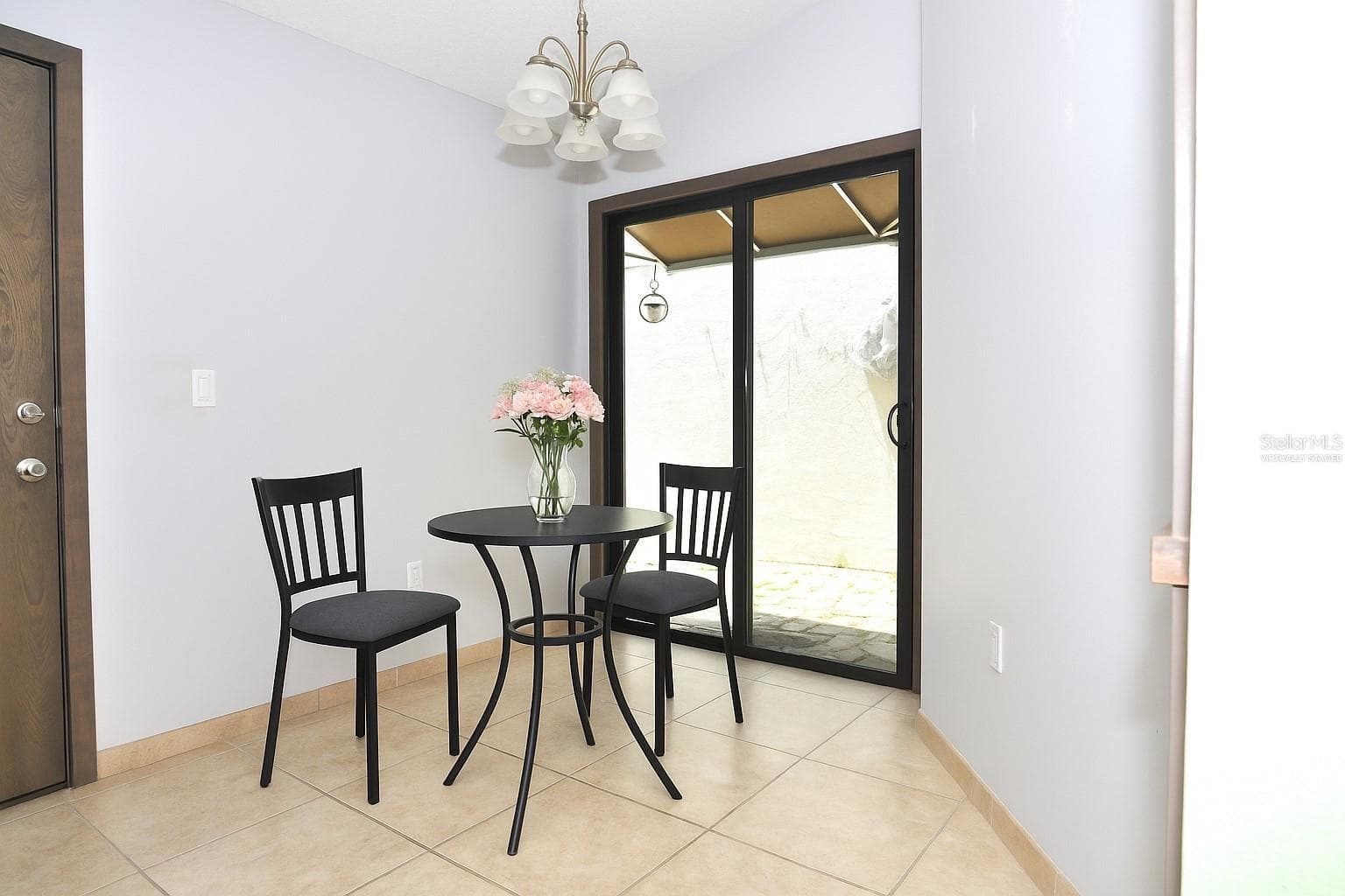 Virtually staged dinette - 5565 SALEM SQUARE DR N, PALM HARBOR