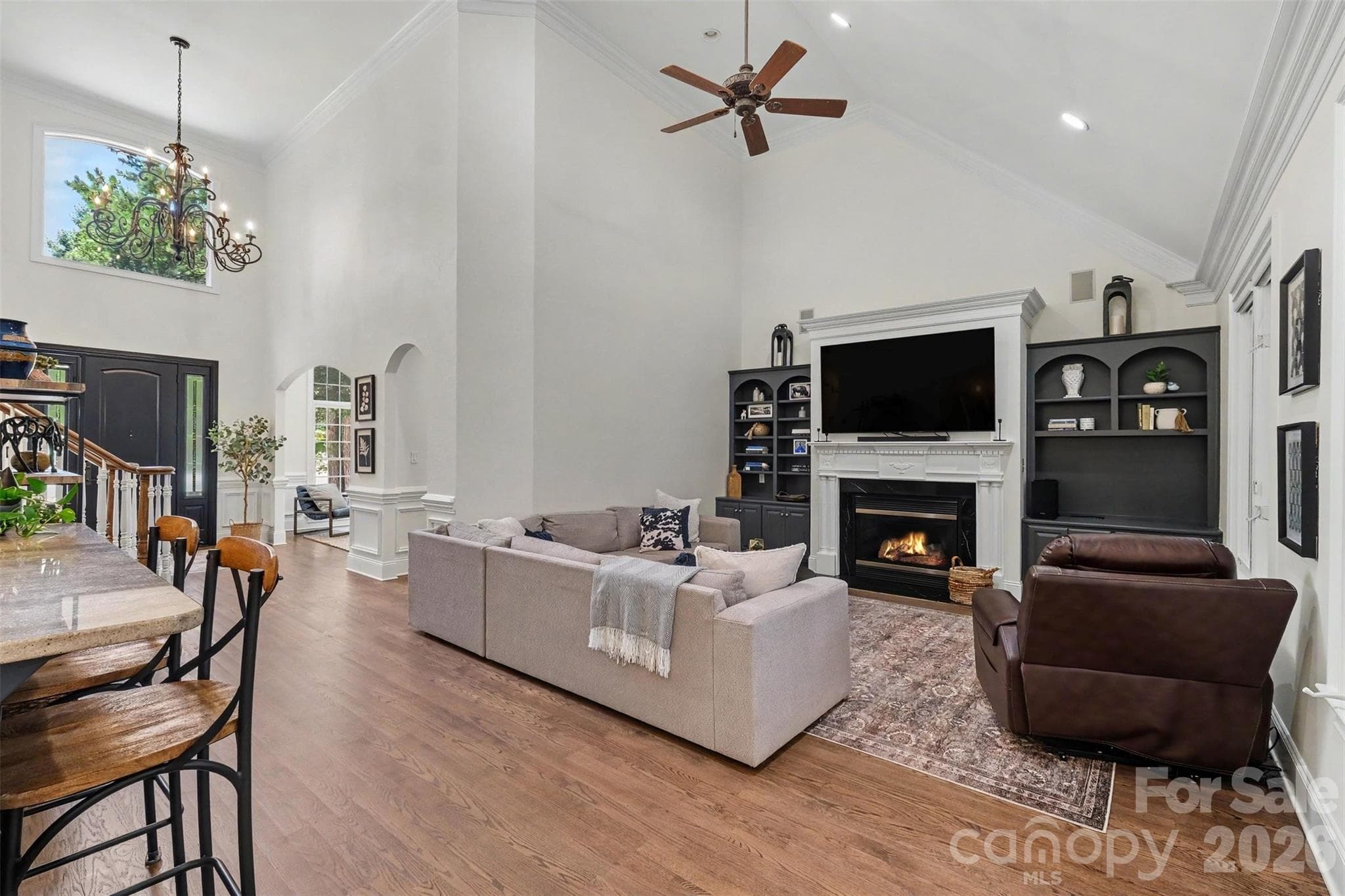 Vaulted great room with gas fireplace and custom built-ins. - 109 Whiterock Drive, Mount Holly