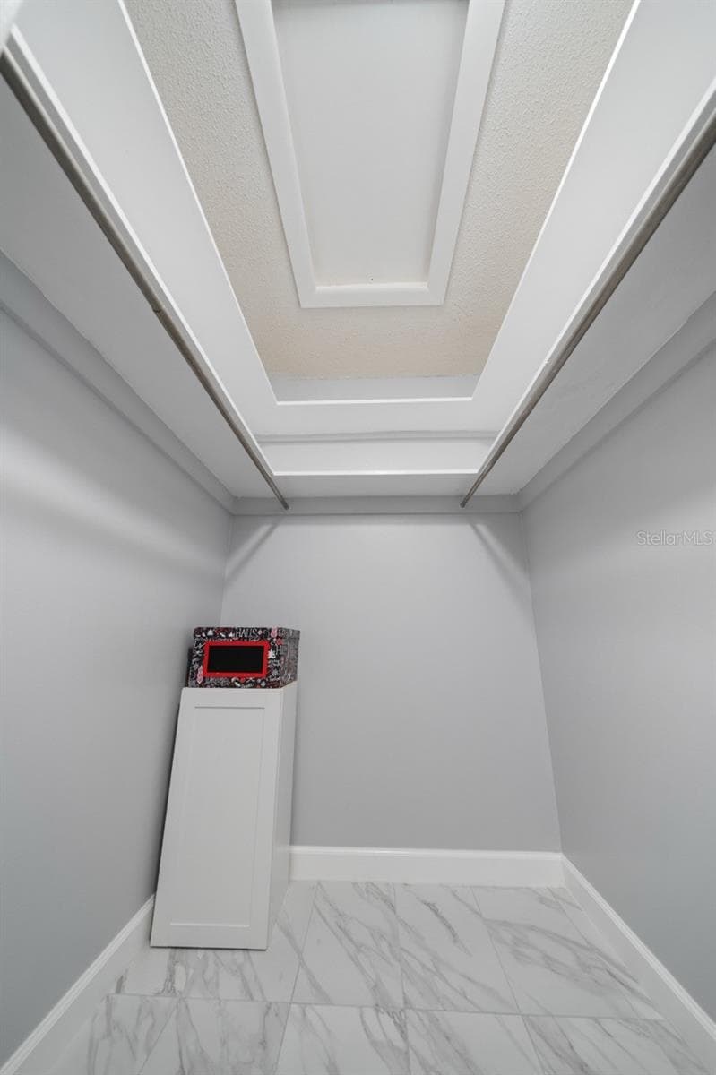 HALL CLOSET, STORAGE, ATTIC ACCESS. PREVIOUSLY GREAT GRANDKIDS PLAYROOM. IT'S THAT BIG. THERE IS ALSO A LINEN CLOSET IN THIS HALL. - 8235 BURGUNDY DR N #3, PINELLAS PARK