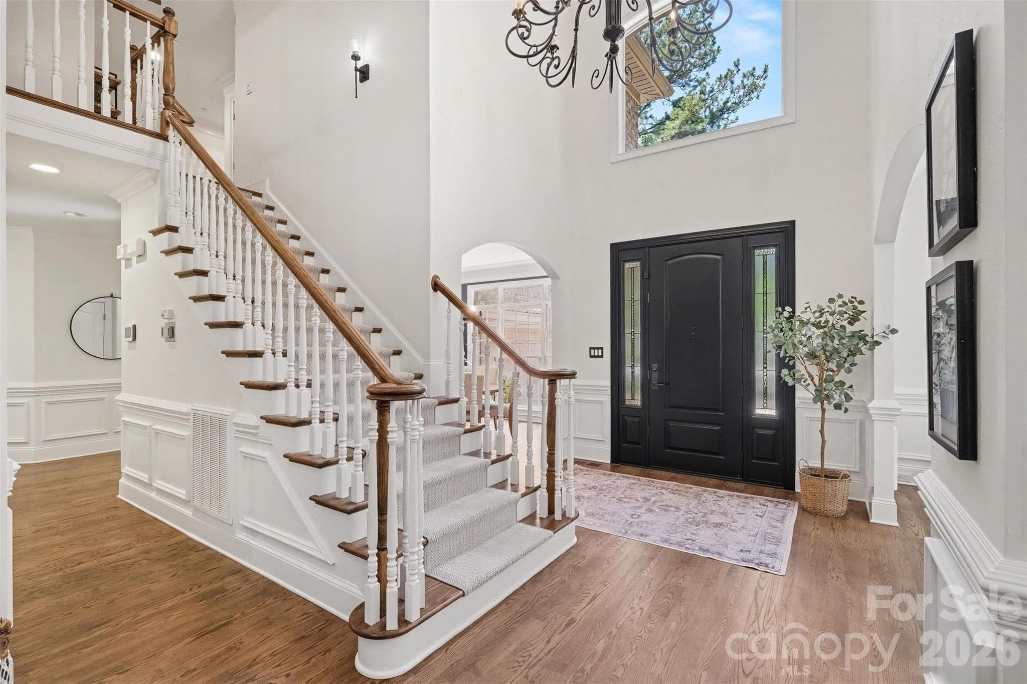 Grand two story foyer with soaring ceilings is flanked by formal living and dining rooms. Note the beautiful hardwood flooring throughout. - 109 Whiterock Drive, Mount Holly