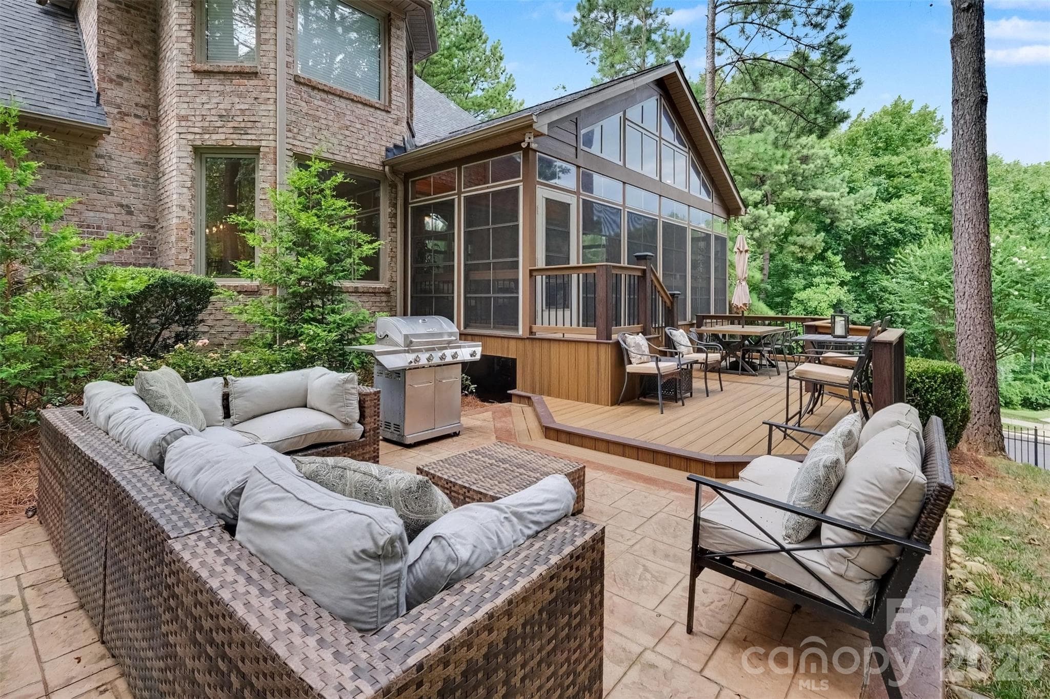 Trex/composite deck and patio overlooking mature landscaping and seasonal water views. - 109 Whiterock Drive, Mount Holly