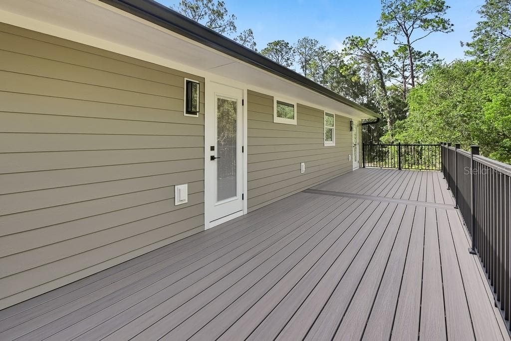 Deck access from dining room & master bedroom - 1530 DEERMOSS LN, DELAND