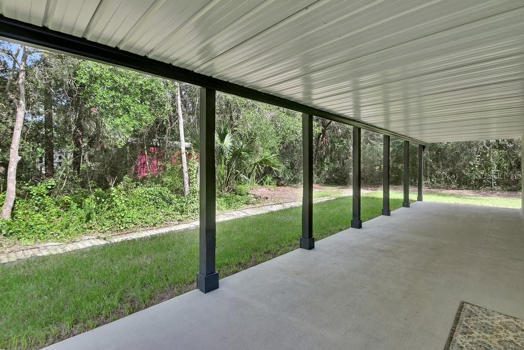 Patio under the upstairs deck. 42x10 - 1530 DEERMOSS LN, DELAND