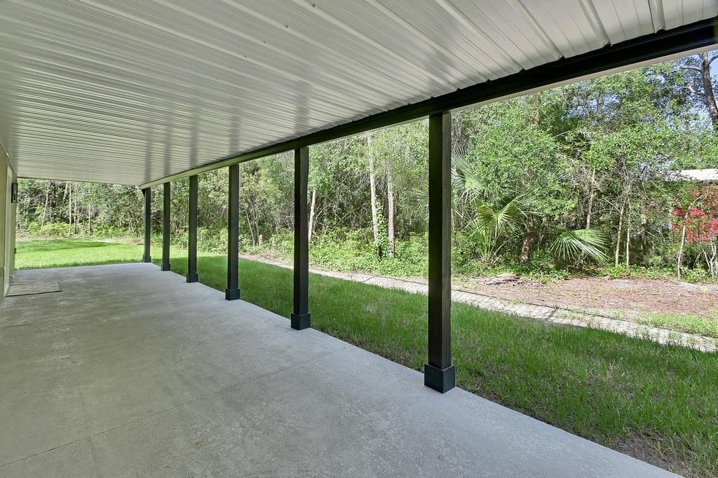 Under decking ceiling. Enjoy the patio in the rain. - 1530 DEERMOSS LN, DELAND