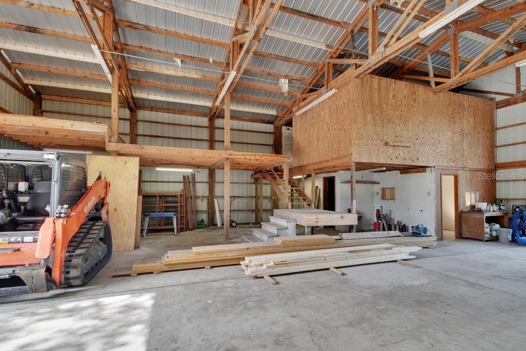 A stairway leads to 2 storage areas which has new plywood decking. - 1530 DEERMOSS LN, DELAND