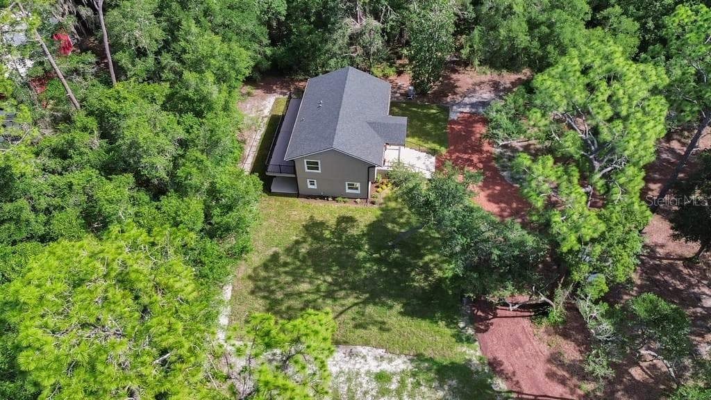 View of deck & patio. Outdoor living space. Use year round! - 1530 DEERMOSS LN, DELAND
