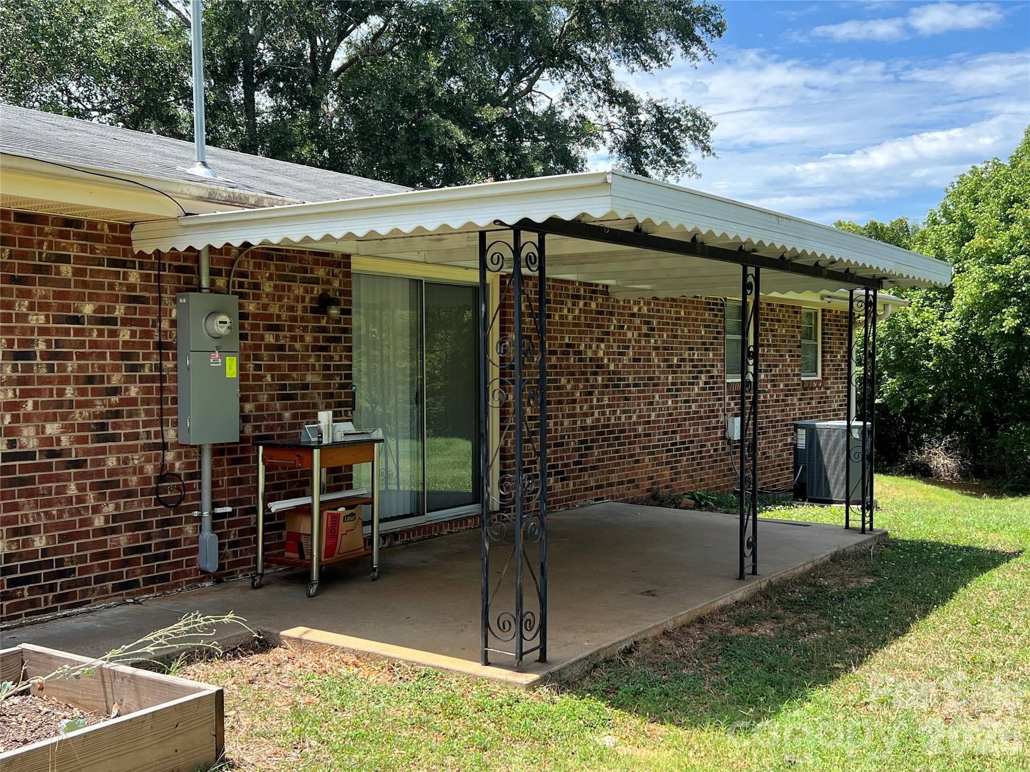 Back covered porch with sliding glass doors - 649 Pine Street Extension, Forest City