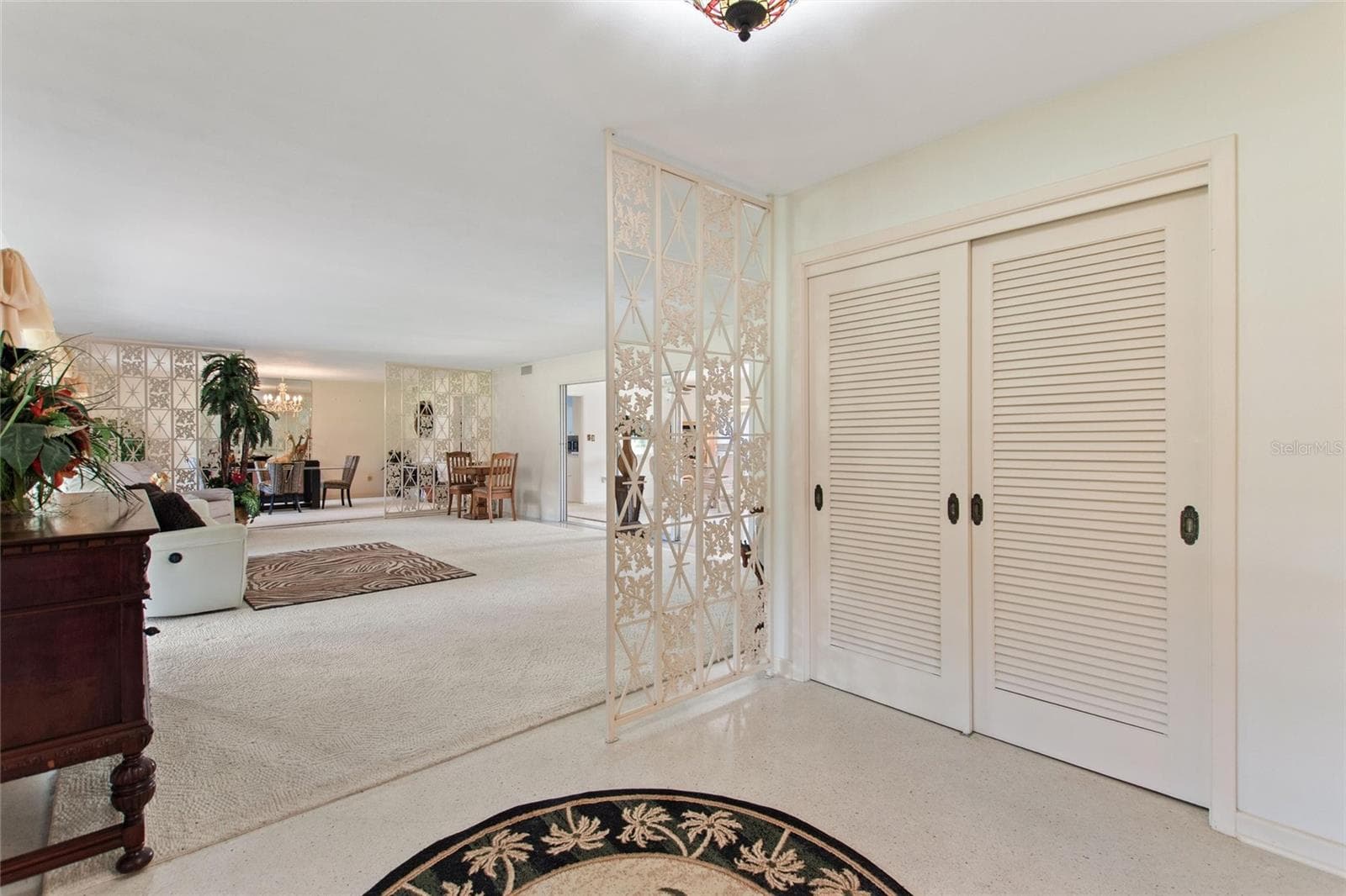 What a beautiful entrance. The double doors open to a storage closet. - 6197 AMARYLLIS DR, INDIAN LAKE ESTATES