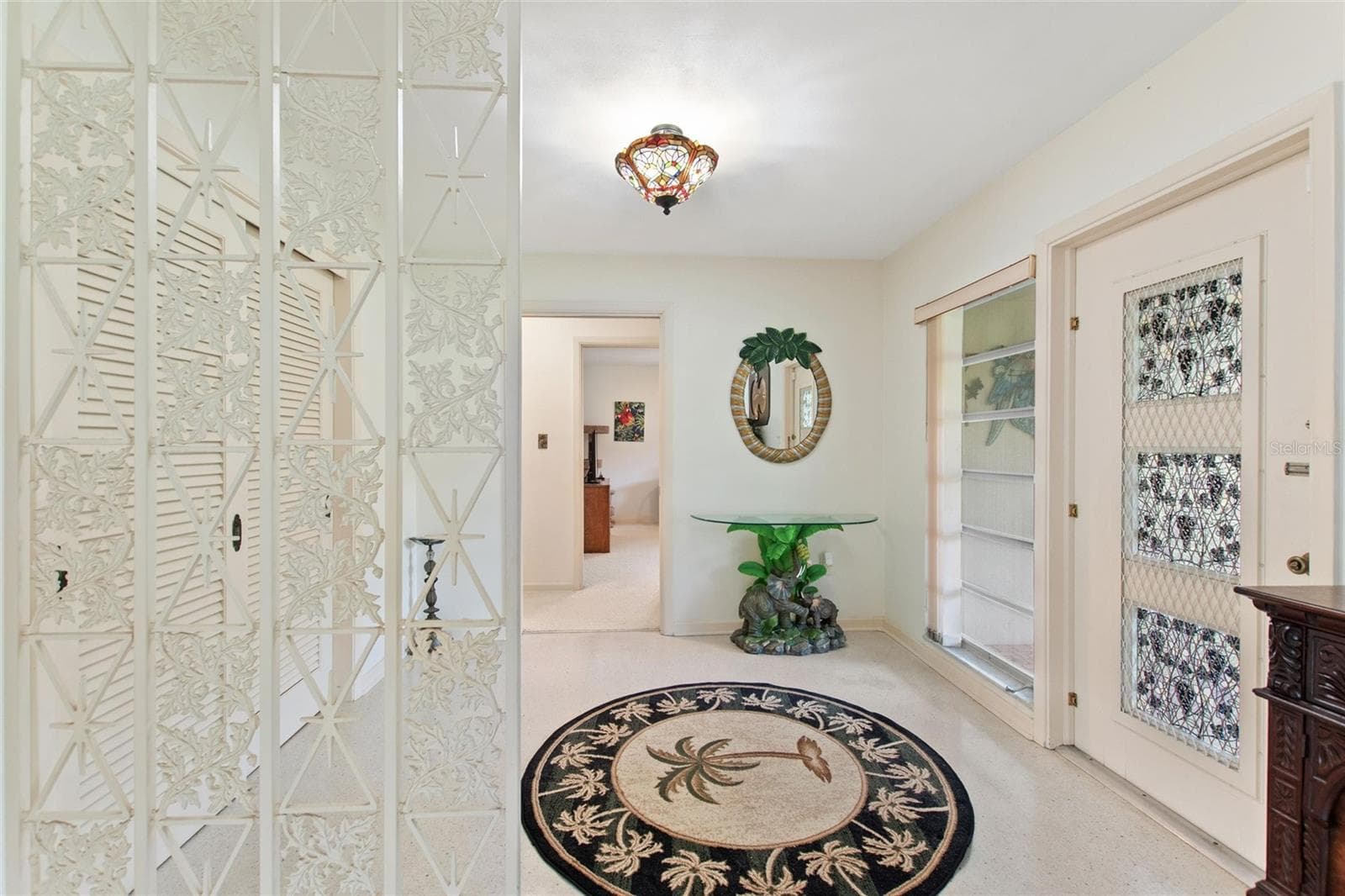Foyer entrance. To the right leads to bedrooms on the south side of the house. - 6197 AMARYLLIS DR, INDIAN LAKE ESTATES