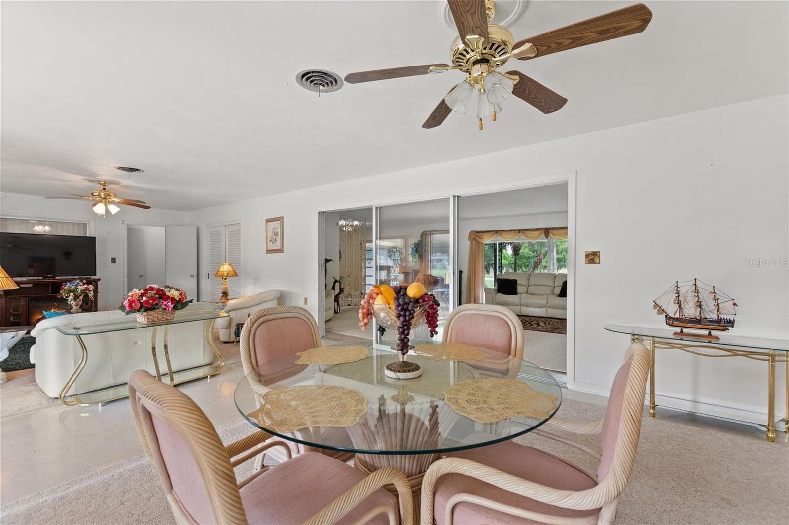 View of family room and informal eating area with view into formal areas. - 6197 AMARYLLIS DR, INDIAN LAKE ESTATES