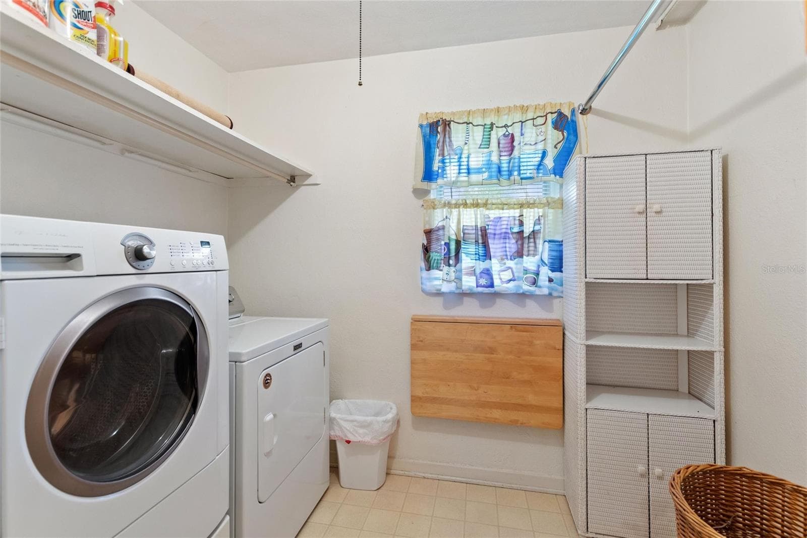 Laundry area accessible from the private suite. - 6197 AMARYLLIS DR, INDIAN LAKE ESTATES
