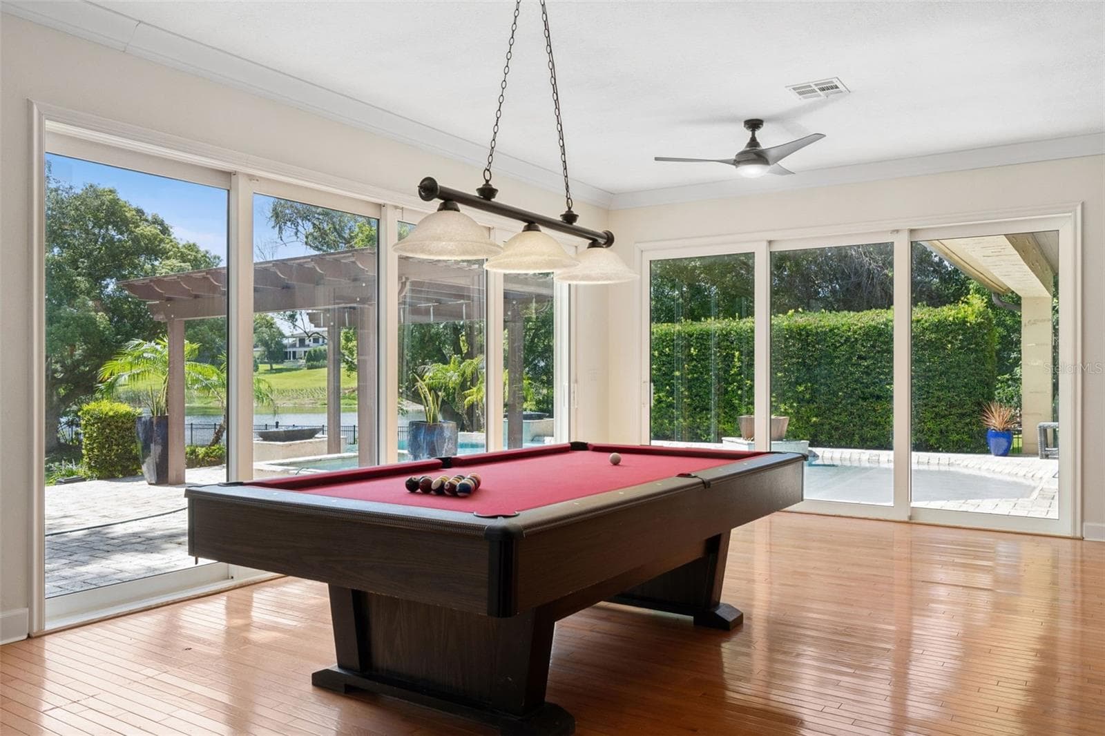 Game area of the GREAT ROOM. Large Sliding doors to open up the fresh air and always the view of the Lake and natural light - 1629 HEMPEL AVE, WINDERMERE