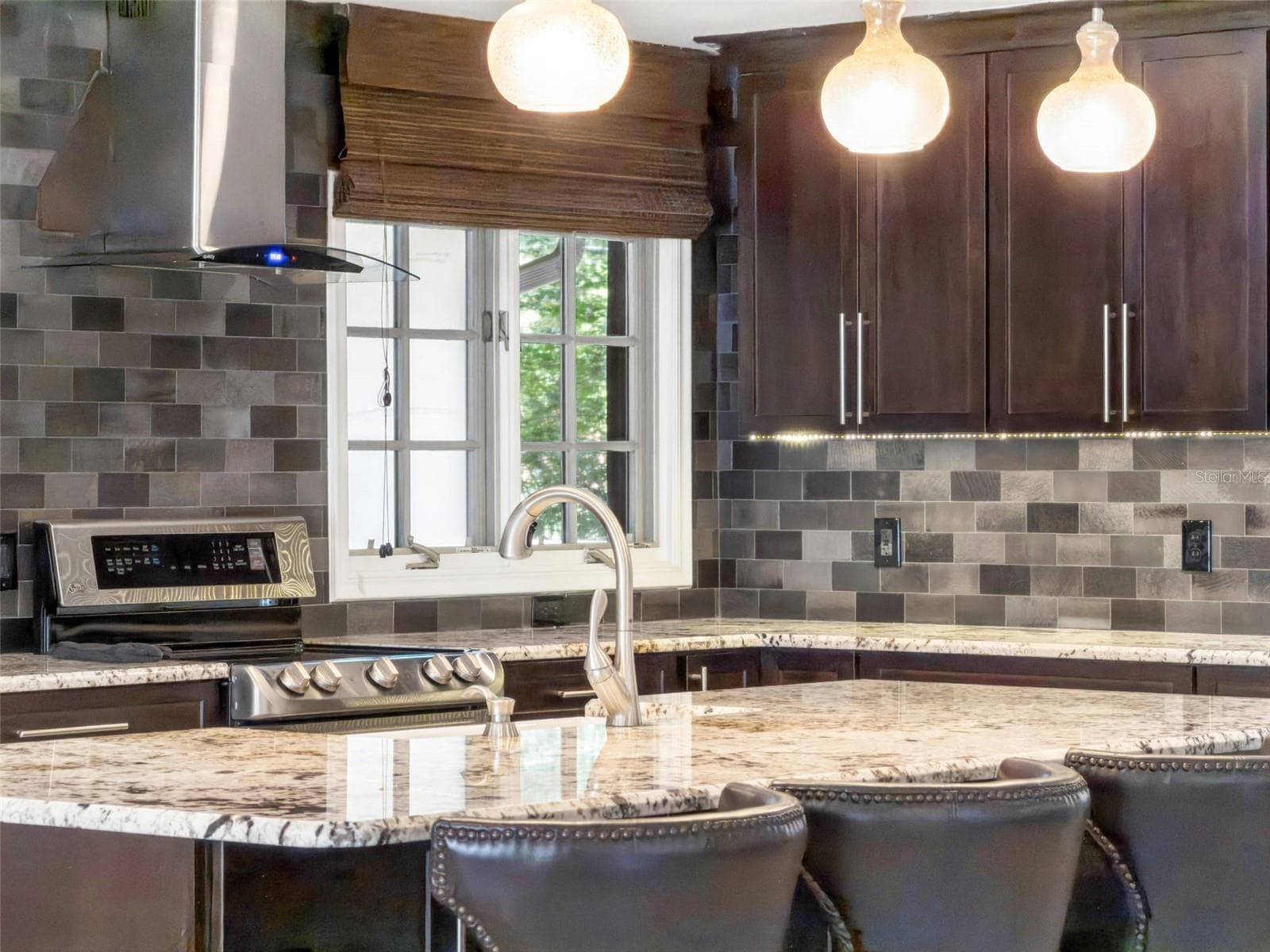Under cabinet lighting, Stainless exhaust and Natural light enhance the kitchen. - 1629 HEMPEL AVE, WINDERMERE