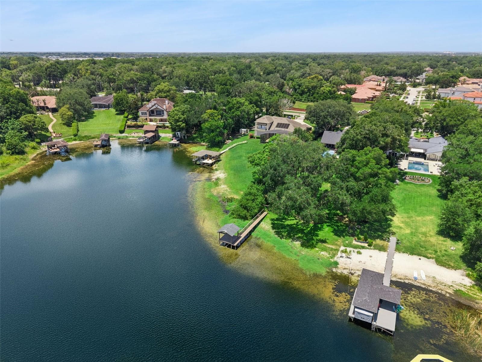 Neighbor converted their shoreline to a beach. - 1629 HEMPEL AVE, WINDERMERE
