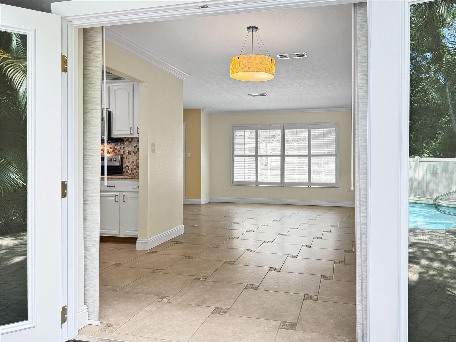 Patio into Dining Room - 1011 WINDING OAKS DR, PALM HARBOR