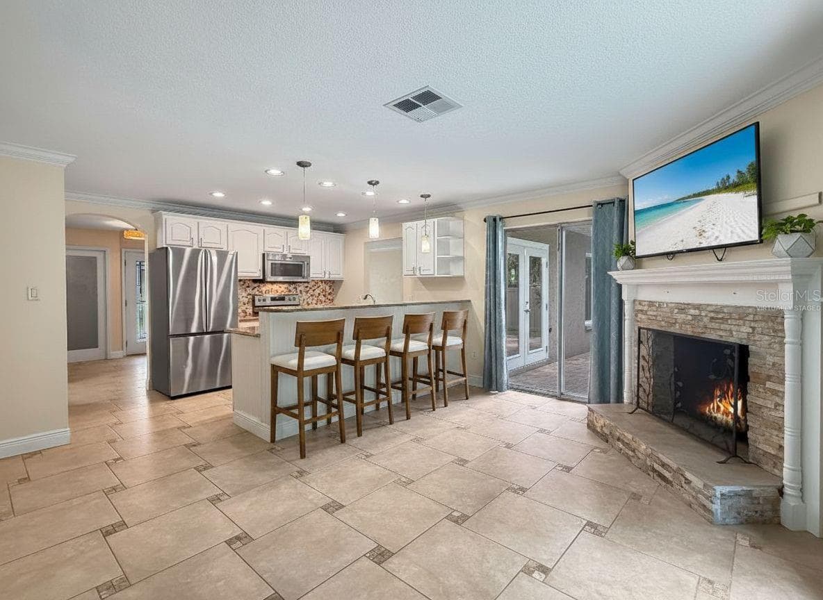 Family Room - Virtually Staged - 1011 WINDING OAKS DR, PALM HARBOR