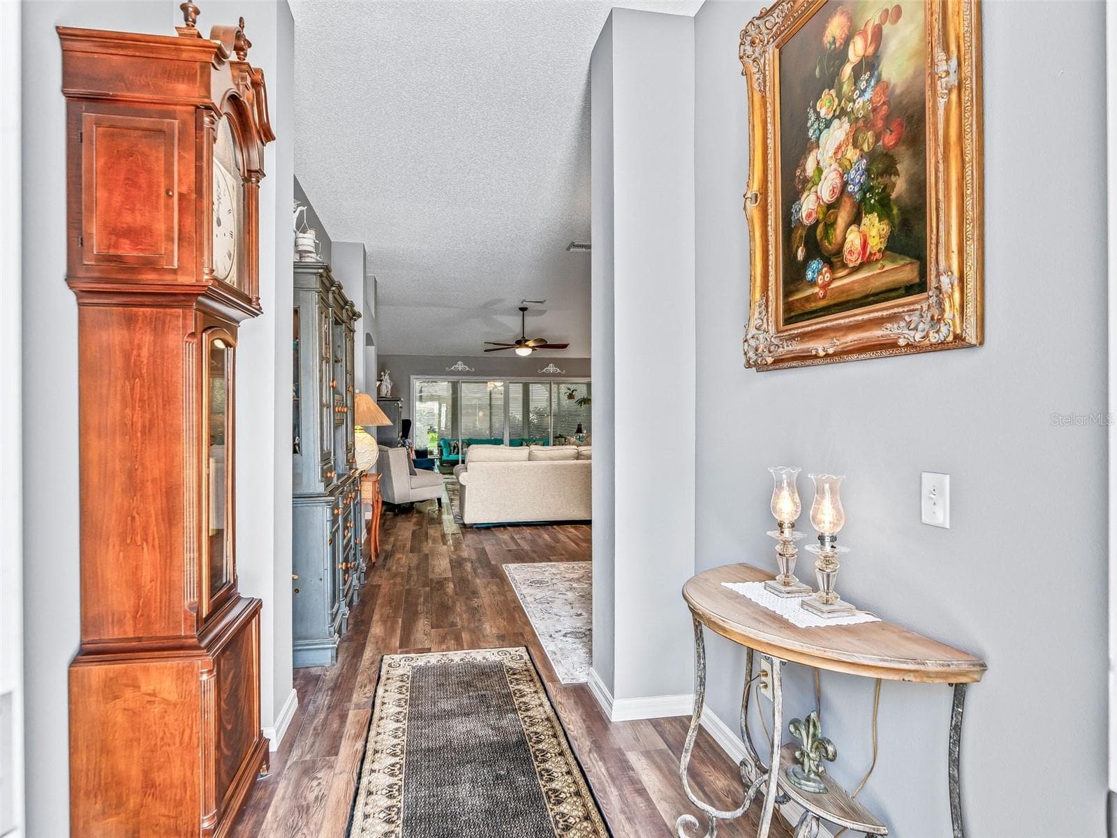 A long, inviting foyer with attractive wood-look High-end LVP flooring provides a clear sightline into the home’s open living spaces. - 17946 SE 87TH MELROSE CT, THE VILLAGES
