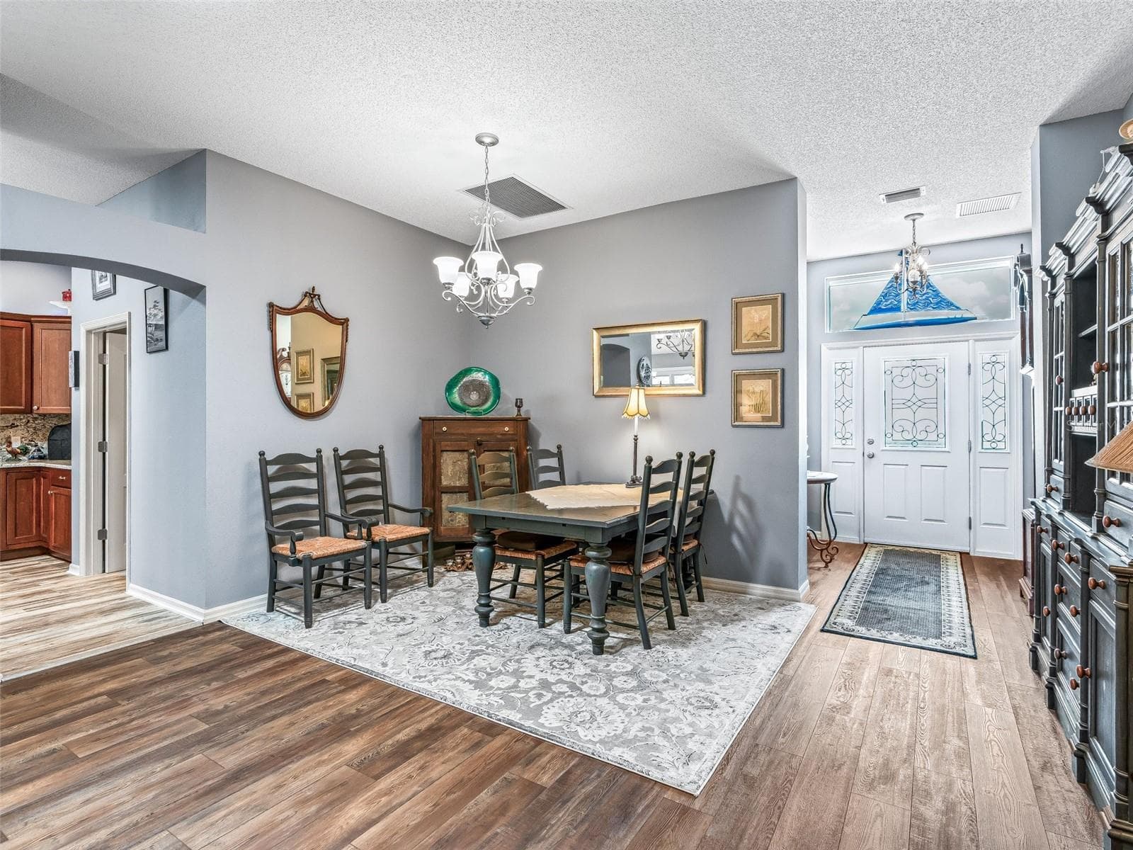 The dining area is thoughtfully positioned between the foyer and main living spaces, with ample room for a full-size table and accompanying furniture. - 17946 SE 87TH MELROSE CT, THE VILLAGES