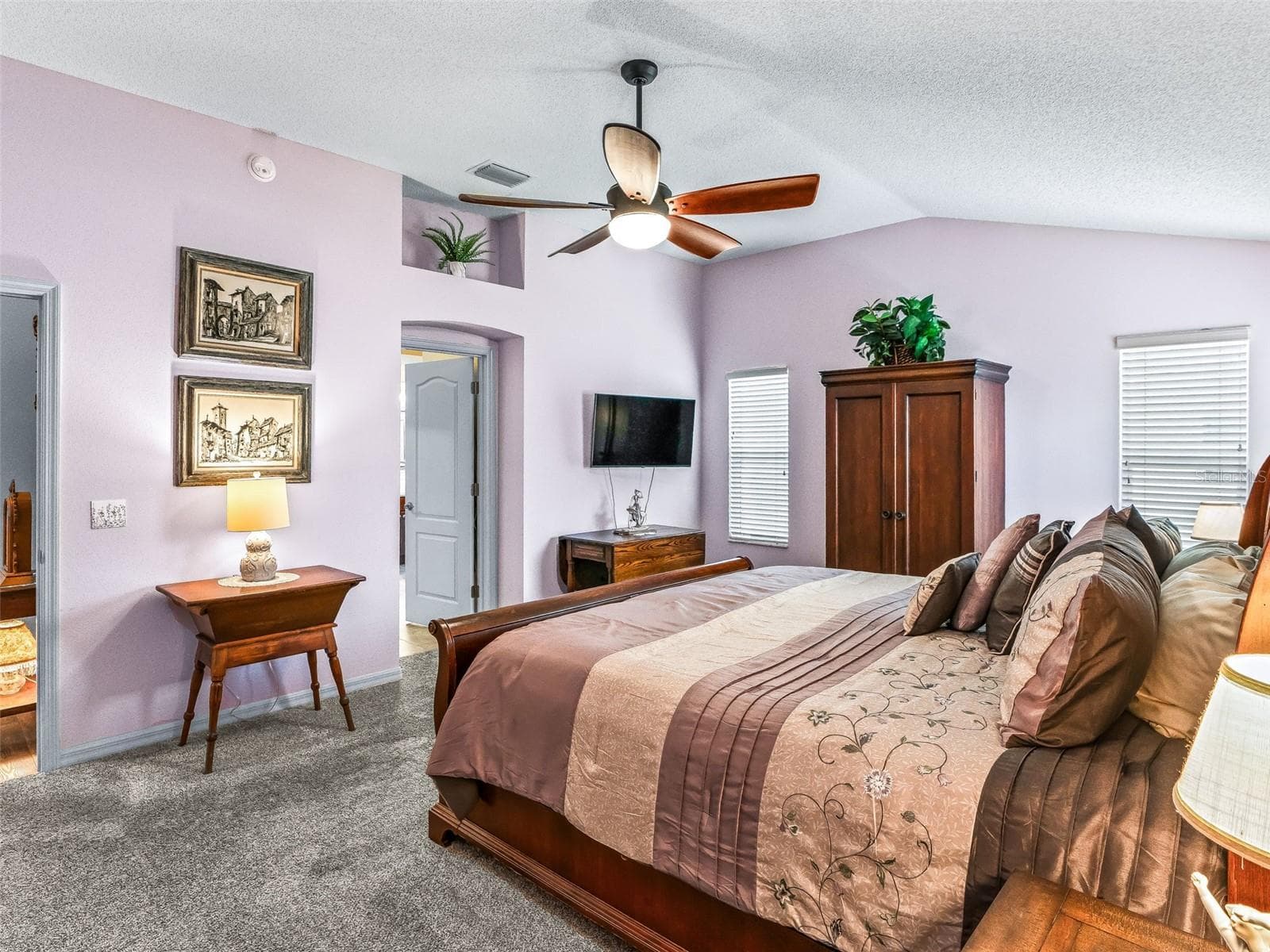 The spacious primary bedroom provides room for a king-size bed, dressers, a sitting area, and additional furnishings without feeling crowded. - 17946 SE 87TH MELROSE CT, THE VILLAGES