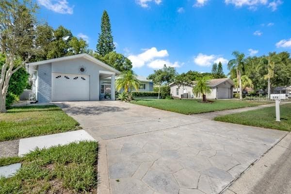 FRONT VIEW WITH GORGEOUS DRIVEWAY - 133 STAFFORD CIR, PALM HARBOR