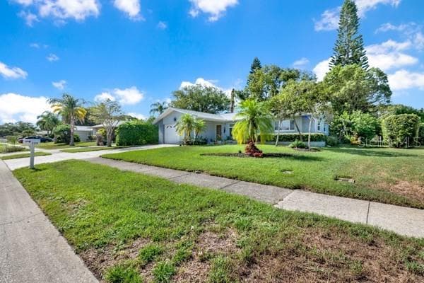 SIDE VIEW WITH LARGE YARD - 133 STAFFORD CIR, PALM HARBOR