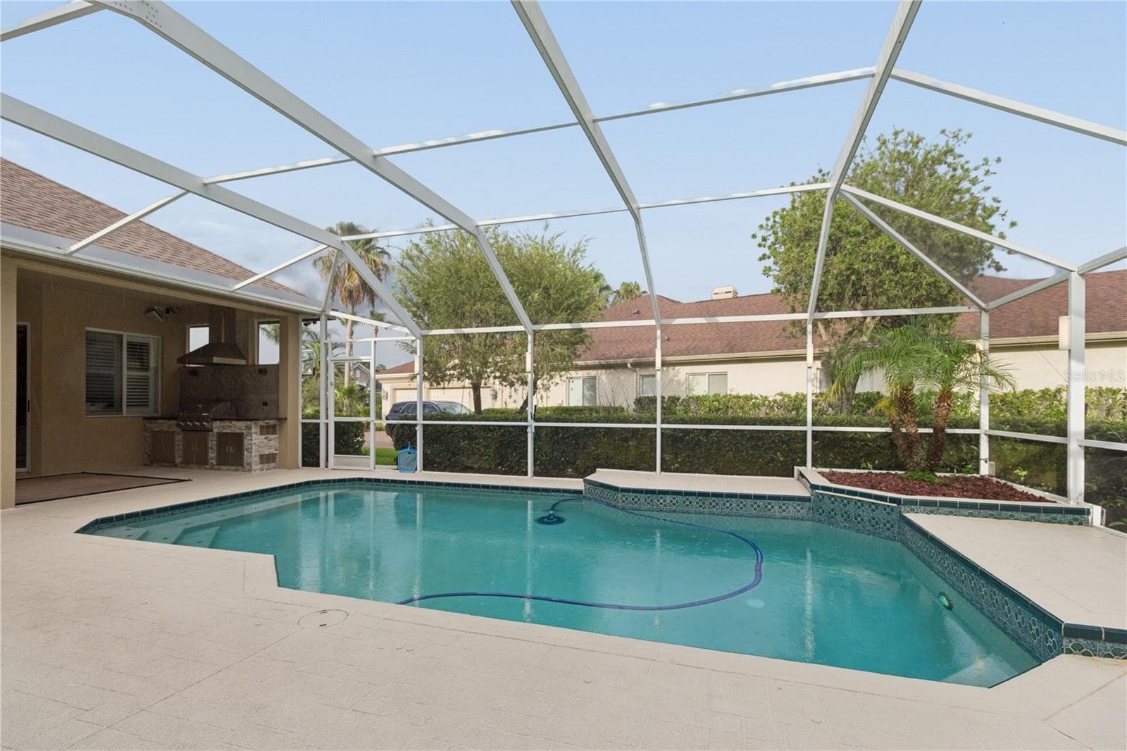 From poolside afternoons to outdoor dinners under the lanai, this backyard is the perfect place to relax, entertain, and enjoy the Florida lifestyle with the people who matter most. - 26920 WINGED ELM DR, WESLEY CHAPEL