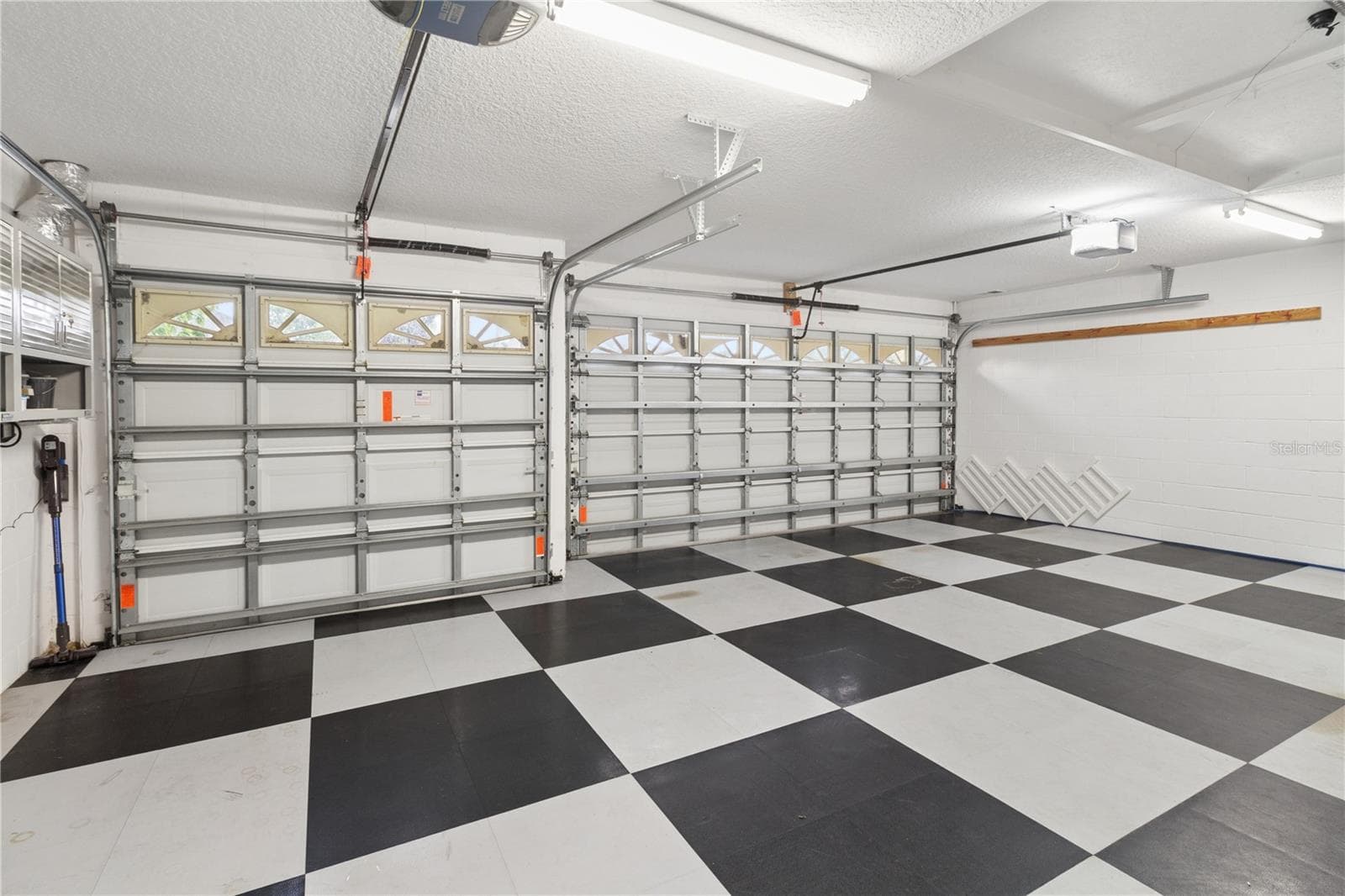 The oversized 3-car garage offers plenty of room for vehicles, storage, hobbies, and all your Florida lifestyle essentials. - 26920 WINGED ELM DR, WESLEY CHAPEL