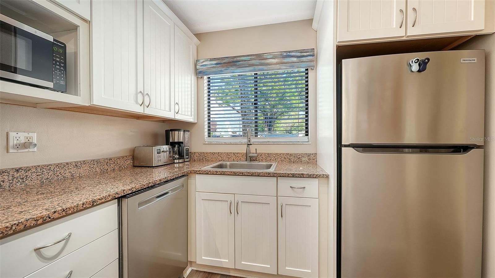 Kitchen with new stainless appliances. - 1646 STICKNEY POINT RD #101, SARASOTA