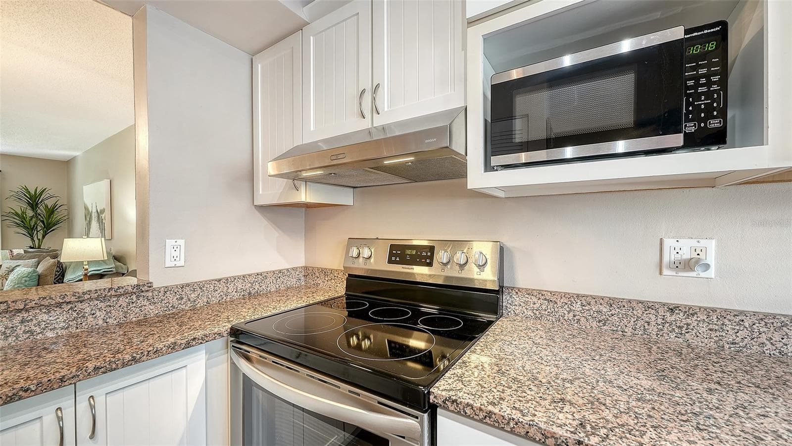 Kitchen with new stainless steel appliances. - 1646 STICKNEY POINT RD #101, SARASOTA