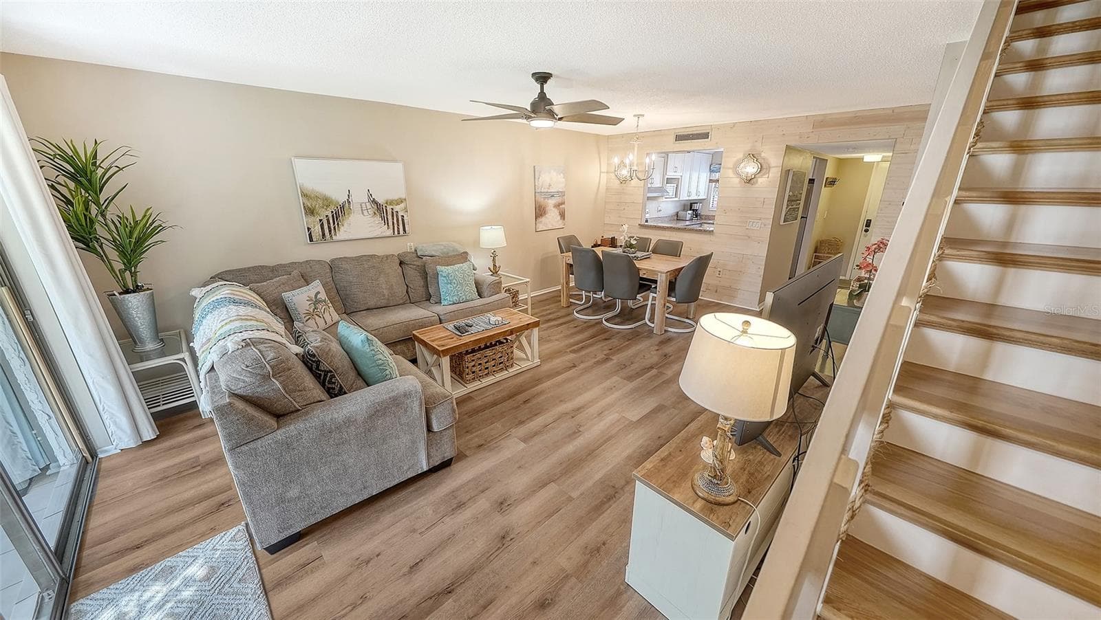Living Room/Dining Room combination and newly redone stairway. - 1646 STICKNEY POINT RD #101, SARASOTA
