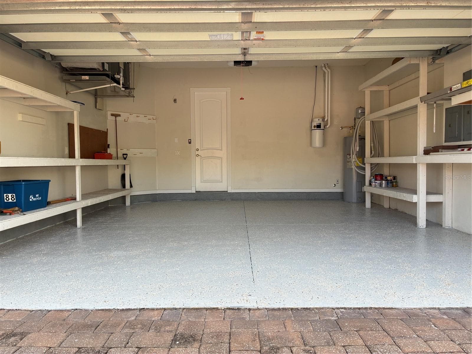 Garage with plenty of built-in storage shelving - 88 HIDDEN CV, FLAGLER BEACH