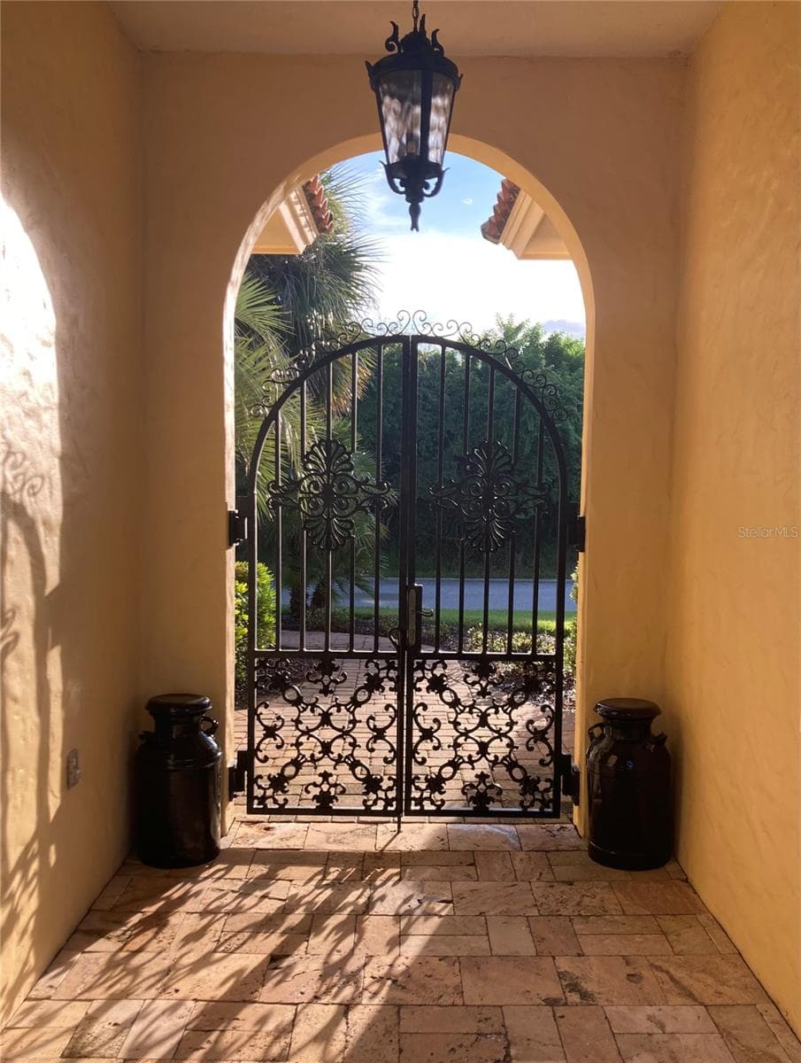 Gates into the courtyard - 88 HIDDEN CV, FLAGLER BEACH