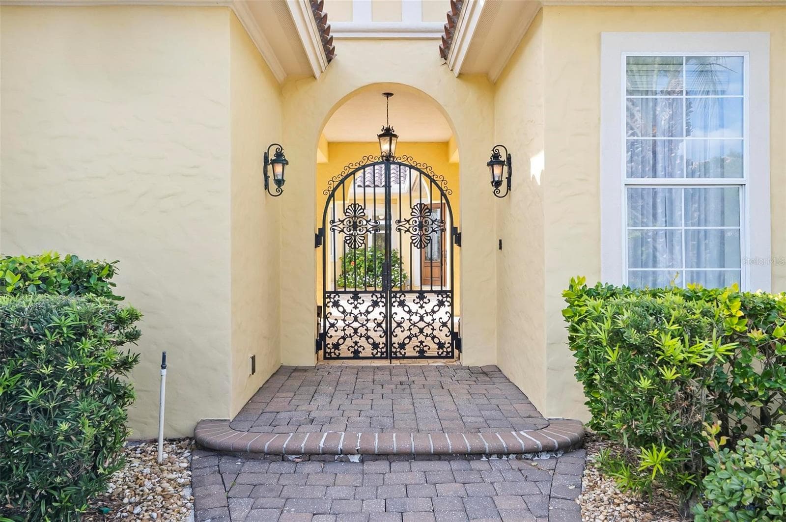 Enter through formal wrought iron gates - 88 HIDDEN CV, FLAGLER BEACH
