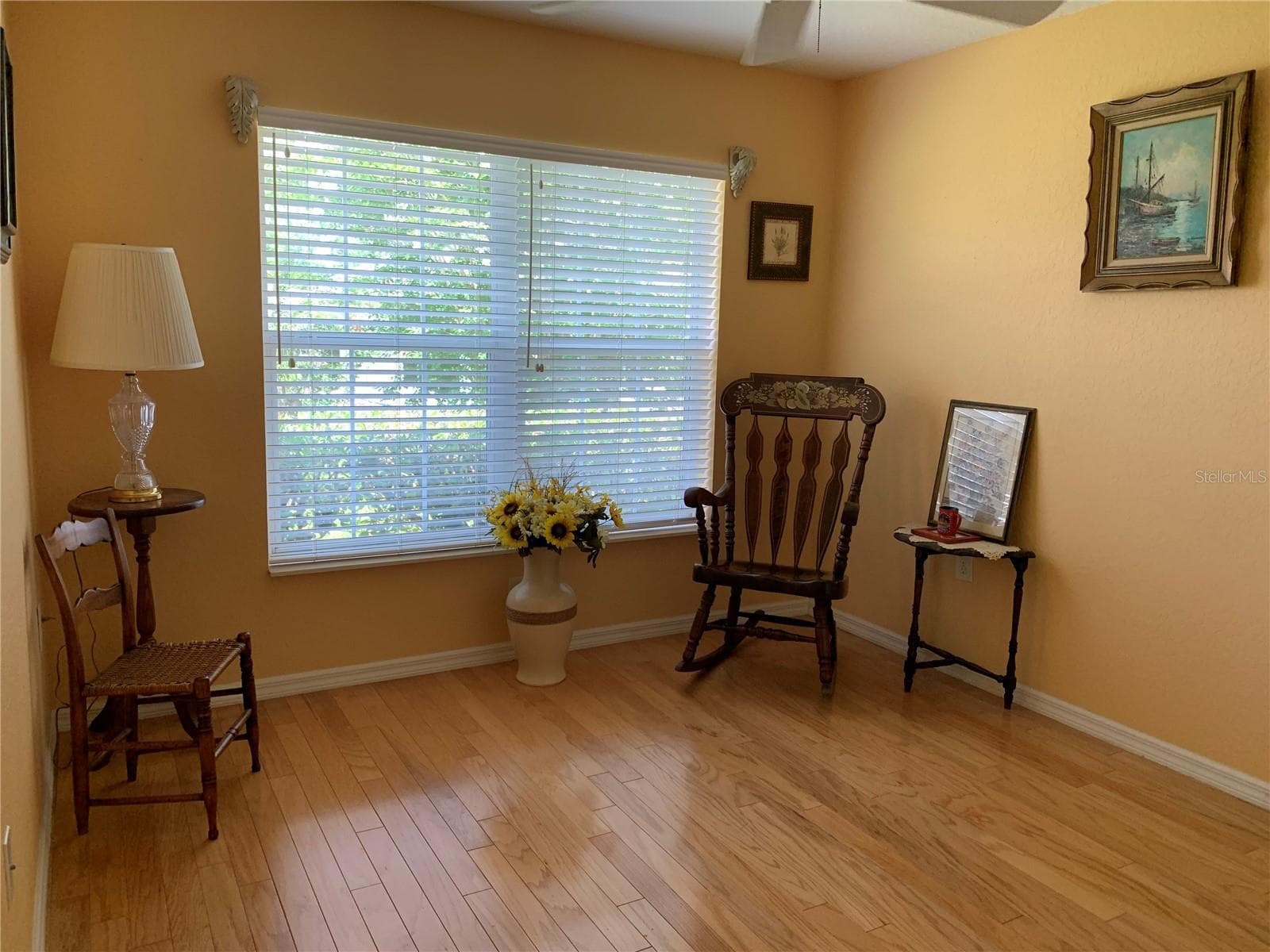 Guest bedroom, staged as reading room but comfortable to fit queen bed plus gorgeous wood floors continue - 6369 SW 117TH LOOP, OCALA