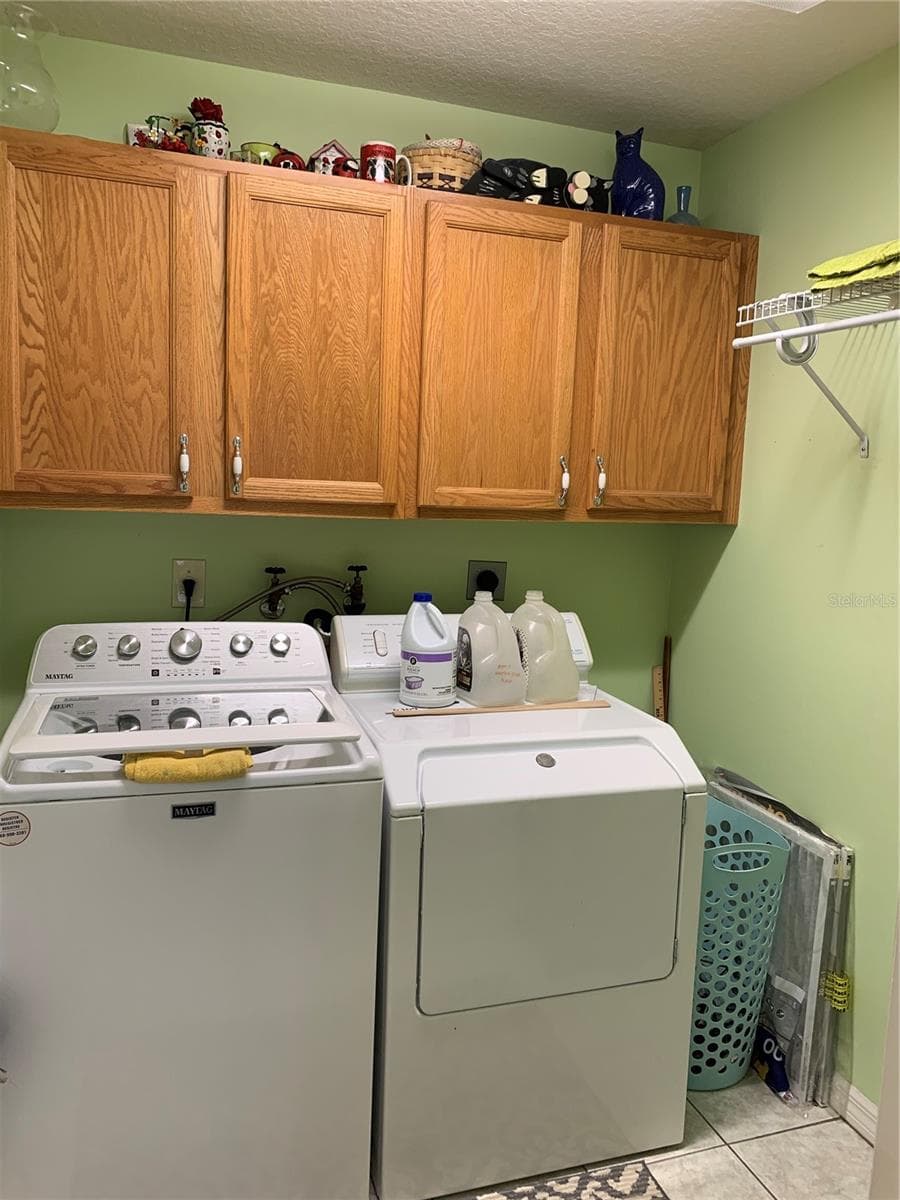 Bonus!! Indoor laundry room with storage and hanging drying rack! Not missing a thing! - 6369 SW 117TH LOOP, OCALA