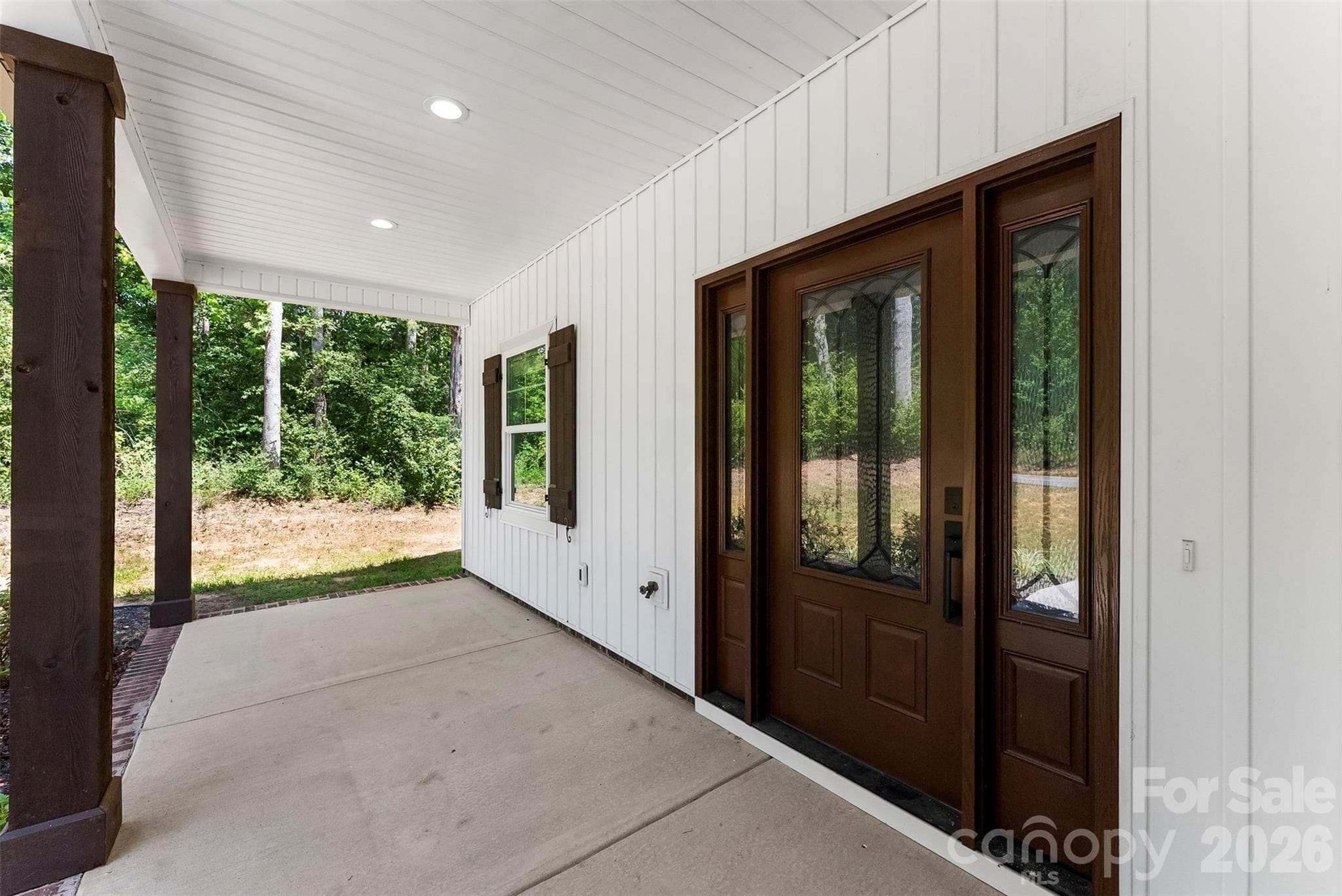 Covered front porch with beautiful front door - 5005 Oconee Drive, Stanley